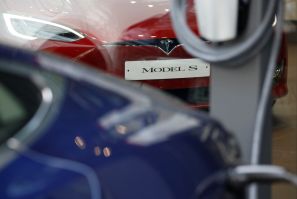 A Tesla Model S electric car is charged by a Destination Charger at its dealership in Seoul