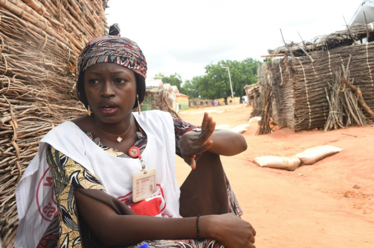 Red Cross volunteer Jacinta Joel registers missing people in a camp for displaced persons in Yola