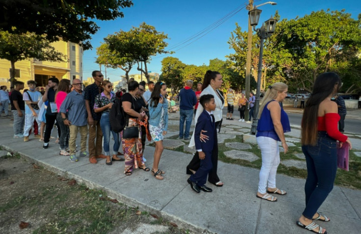 Cubans line up outside the US embassy after it began processiing visas in January 2023