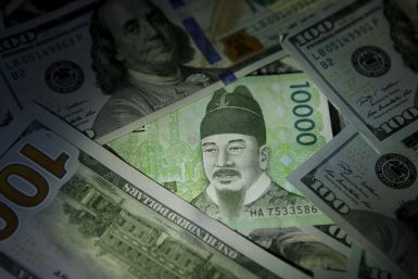 South Korean 10,000 won note is seen on U.S. 100 dollar notes in this picture illustration taken in Seoul