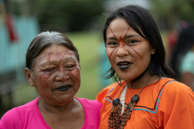 18-year-old Milena Piaguaje (R) traveled with her family from San Pedro to the territory of Pe'keya for a reunion of the Siekopai Indigenous group