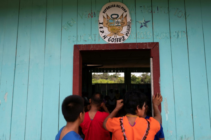 The Siekopai listened to stories from their elders during their reunion in Manoko