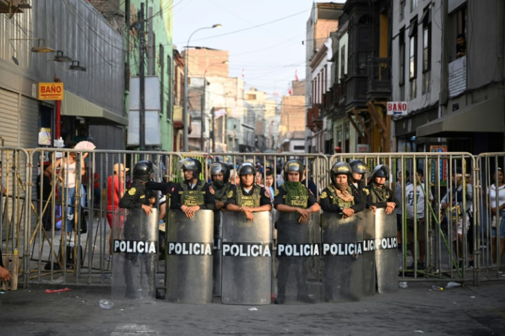 Riot policemen take position during a demonstration against the government of Peru's President Dina Boluarte on February 9, 2023, in Lima