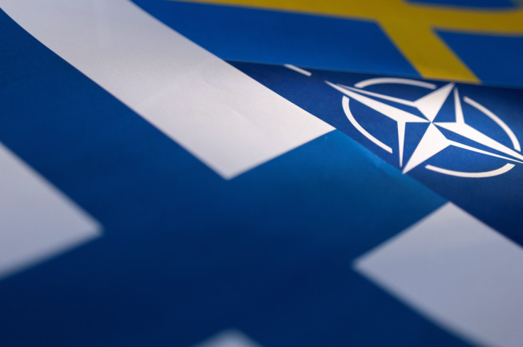 Illustration shows NATO, Swedish and Finnish flags