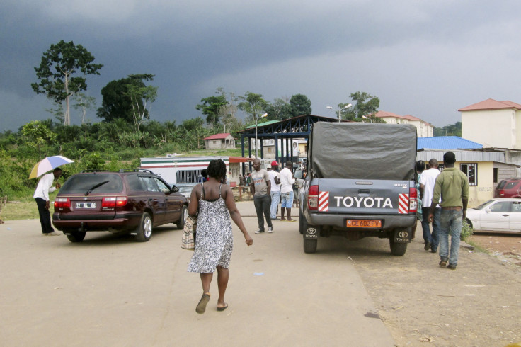 People wait to cross the border into Equatorial Guinea by car and by foot in Kye-Ossi