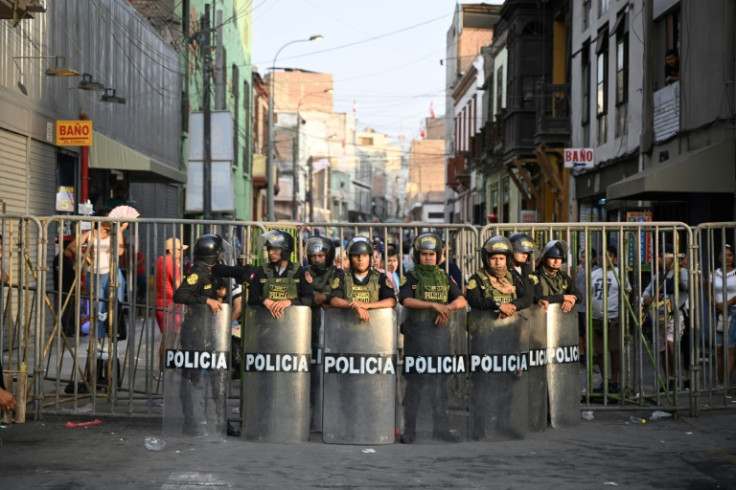 Riot policemen prepare for protests in Lima against Peru's President Dina Boluarte on February 9, 2023