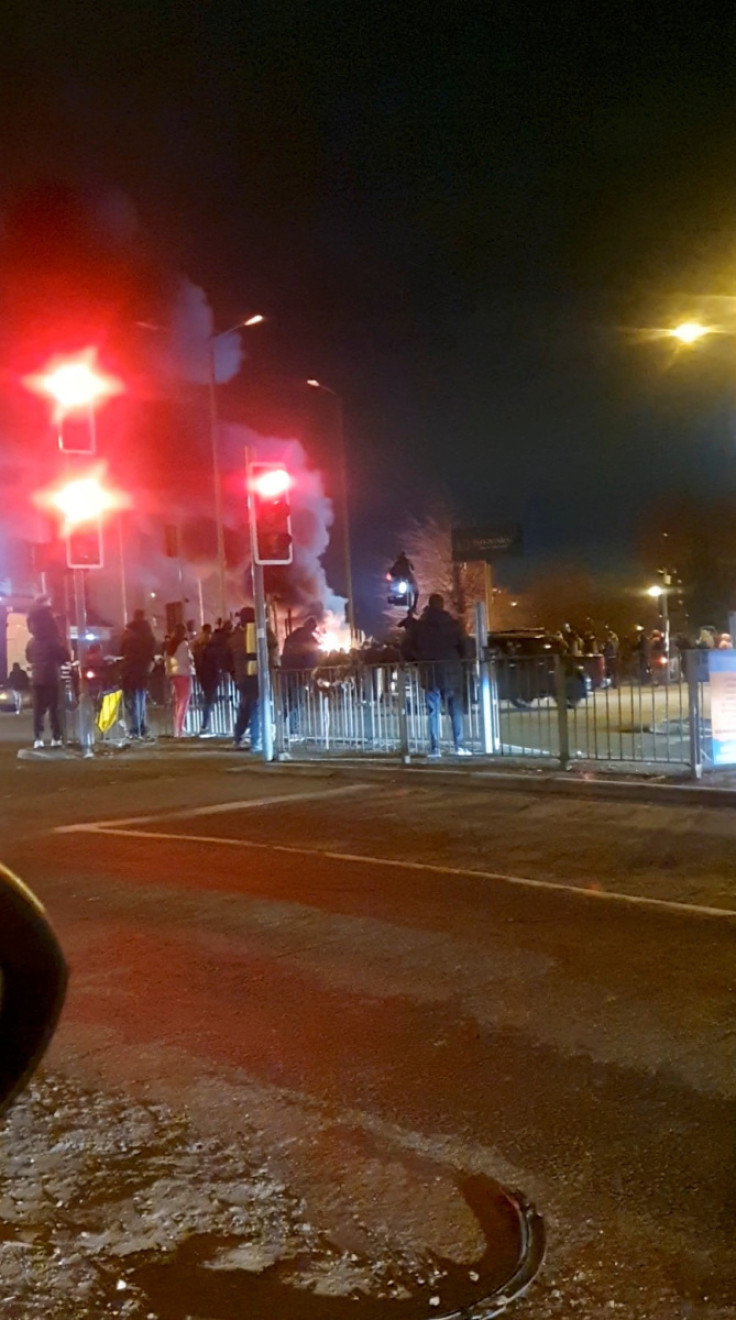 Fire outside a hotel providing refuge to asylum seekers following a protest in Knowsley