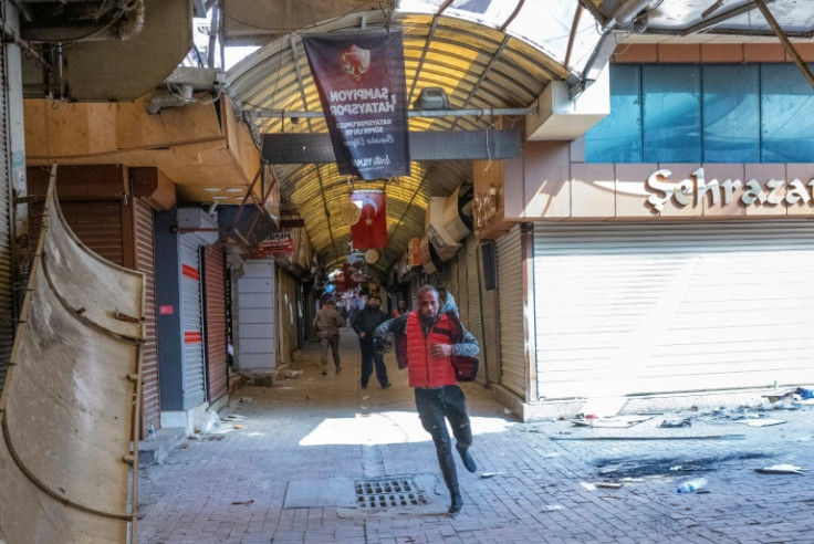 Shopkeepers, like the one in Antakya's bazaar, are on guard alongside security forces, ready to hunt down anyone giving rise to suspicion