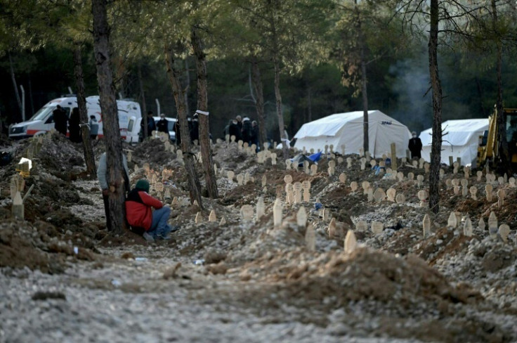 Officials are racing to identify the quake victims and bury them in large graves