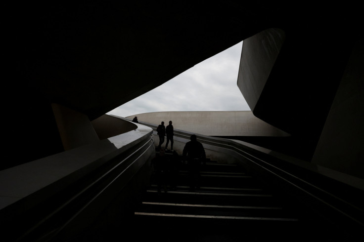 People walk at Eleftherias Square a day ahead of the presidential election in Nicosia
