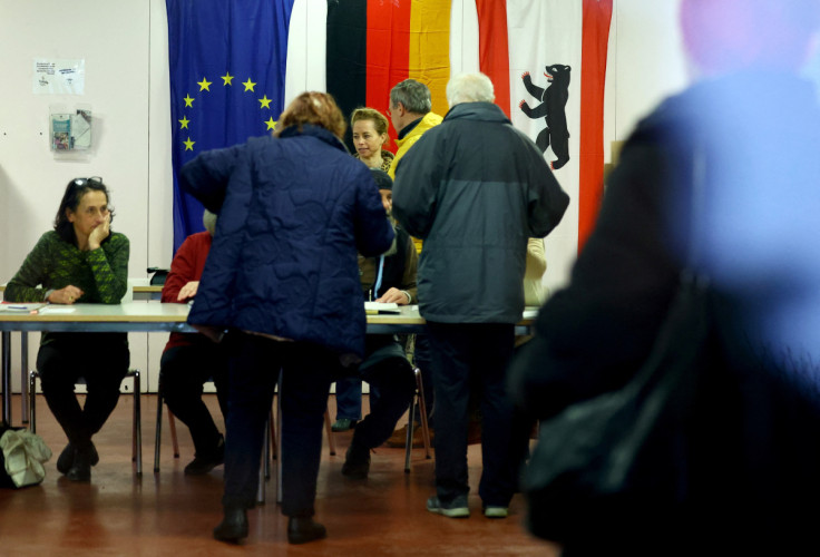 Voters are seen inside a polling station to cast their votes during the repeat state elections in Berlin