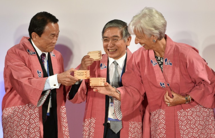 Outgoing Bank of Japan governor Haruhiko Kuroda (C) had both a strong network in Japan and an international profile