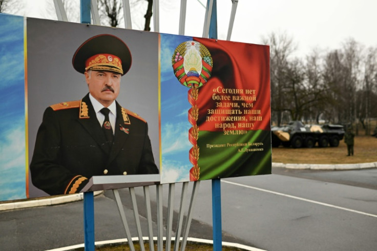 A banner bearing a portrait of Belarusian President Alexander Lukashenko wearing a military uniform