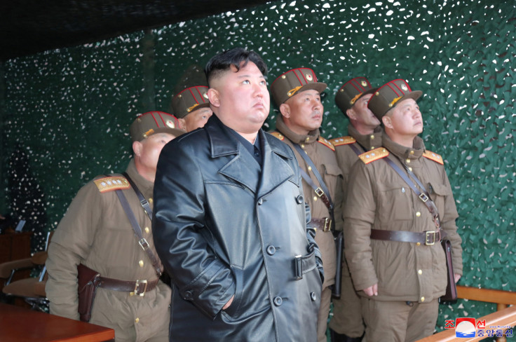 North Korean leader Kim Jong Un observes the firing of suspected missiles