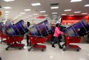 Thanksgiving Day holiday shoppers line up with television sets on discount at the Target retail store in Chicago