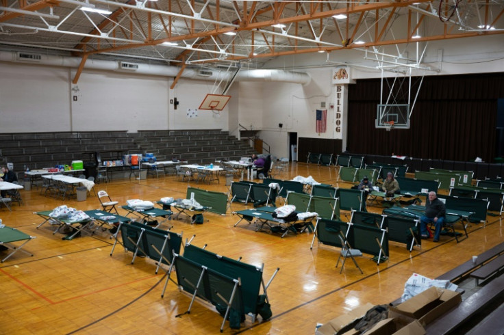 People take shelter at an American Red Cross evacuation support center for residents of East Palestine, Ohio on February 4, 2023 following a train derailment and fire