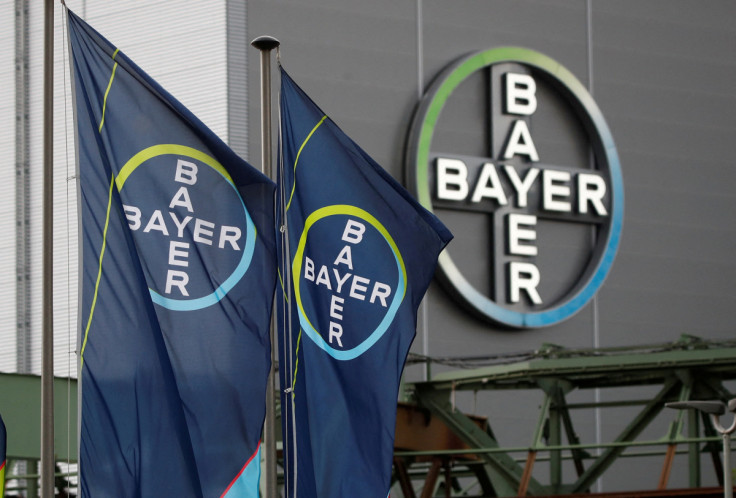 Logo and flags of Bayer AG are pictured outside a plant of the German pharmaceutical and chemical maker in Wuppertal