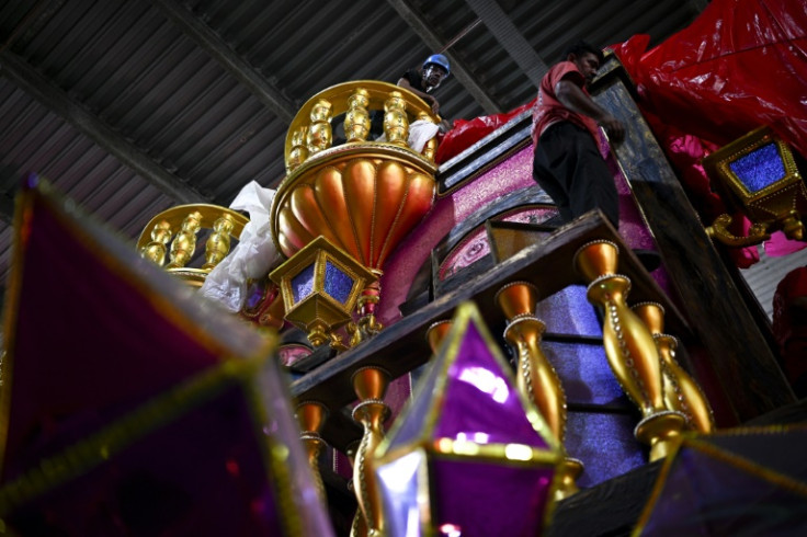 Workers put the finishing touches on a carnival float at the Viradouro samba school's preparation hangar