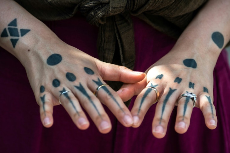 "Hajichi" tattoo artist Moeko Heshiki displays her traditional Ryukyu body art during an interview with AFP in Okinawa