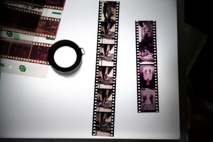 Strips of film shot by photographer Hiroaki Yamashiro sit atop a lightbox at his studio in Naha, Okinawa prefecture