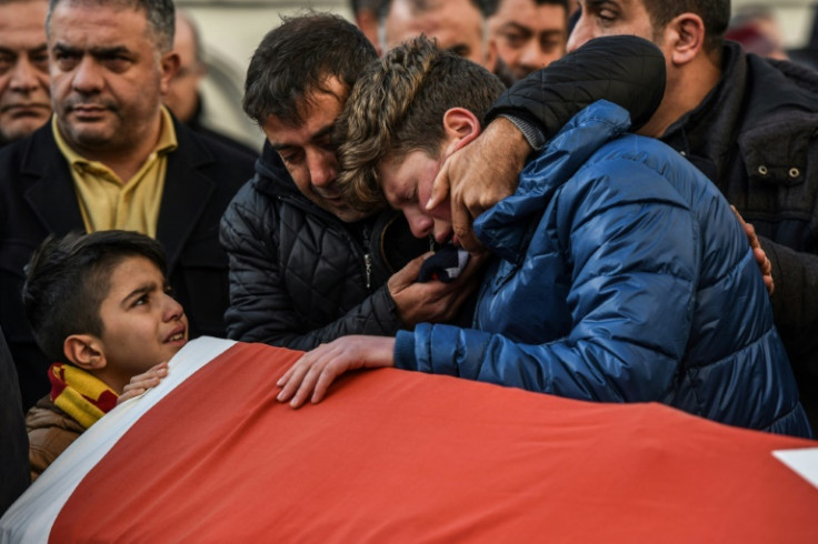 Mourners weep over the coffin of one of the victims of a terrorist attack on a nightclub in Istanbul, Turkey, on January 1, 2017