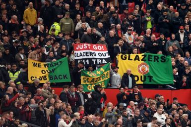 Unpopular owners - Manchester United fans hold banners calling for their team's owners, the Glazer family, to leave the club, during a Premier League match against Leicester at Old Trafford