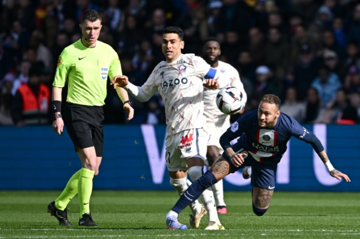 Neymar was stretchered off after turning his ankle in this challenge against Lille