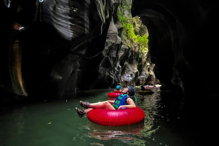 A tourist floats down the Colombia's Guape Canyon, formerly a route for armed rebels, on February 19, 2022