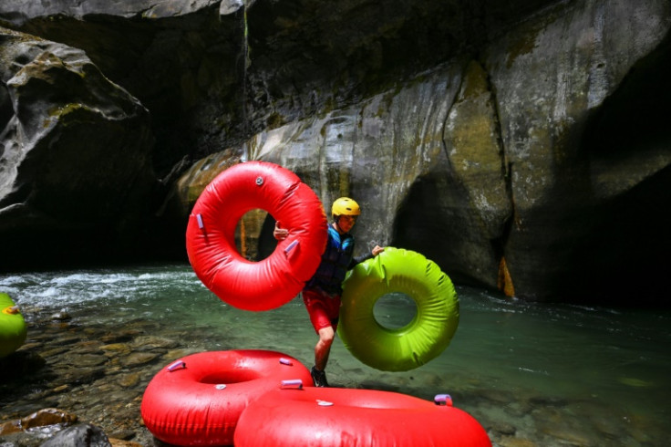 A guide prepares inflatable rubber rings ahead of a new tour of the Guape Canyon, which was kept hidden from Colombians for years by the country's armed conflict