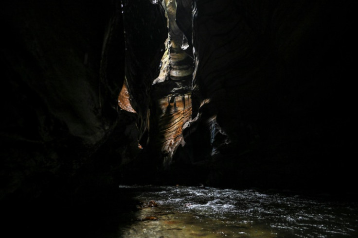 Rays of sunlight illuminate parts of the deep canyon in La Uribe