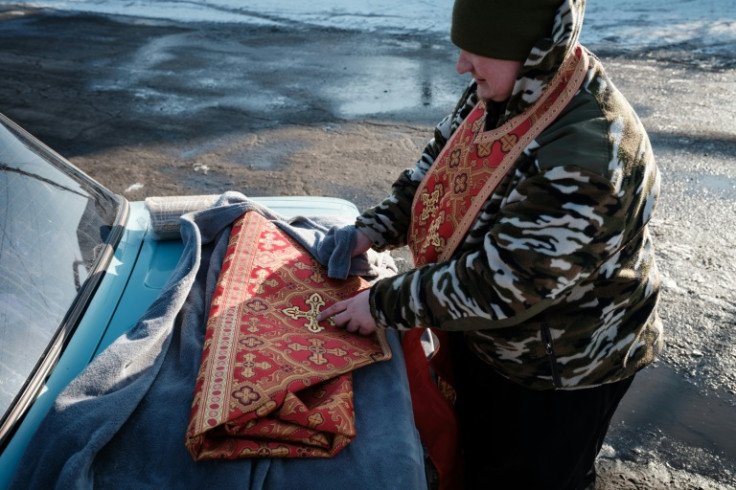 'Father Mykola' follows the unit in a battered Lada 1600