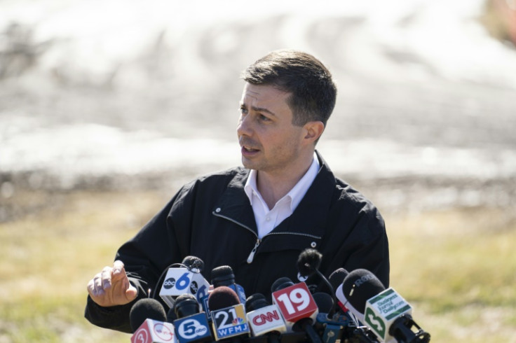 US Transportation Secretary Pete Buttigieg, seen here near the site of a toxic train derailment in East Palestine, Ohio, called on rail companies not to wait for Congress to legislate before introducing safety reforms
