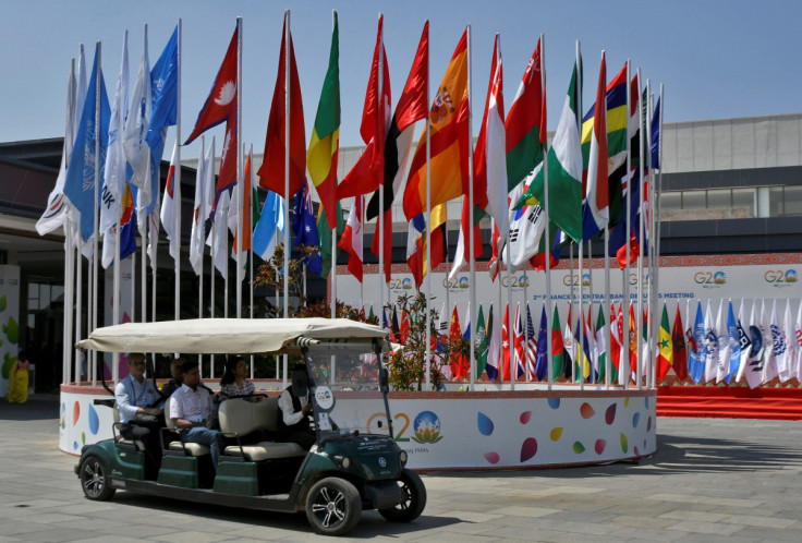 Delegates ride in a buggy at G20 finance officials meeting venue near Bengaluru