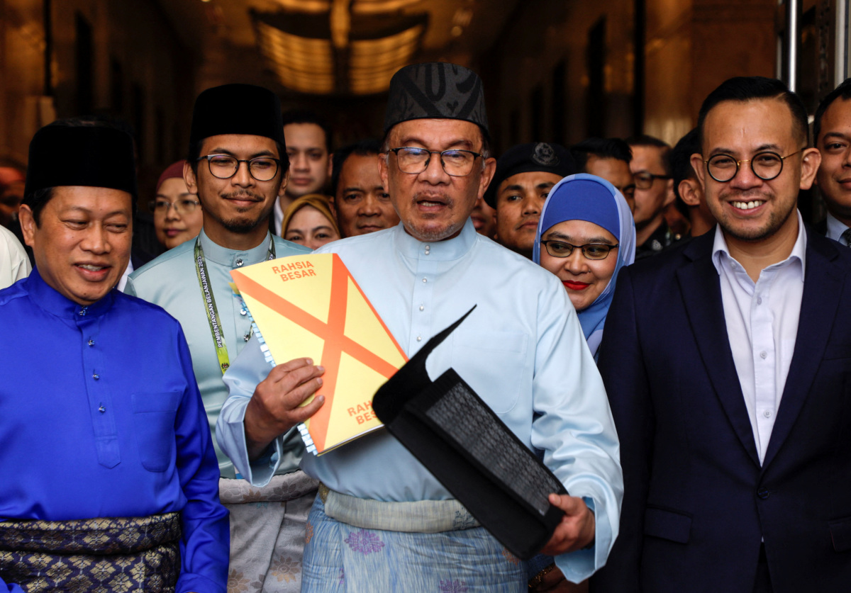 With Eye On Deficit, Malaysia's Anwar Tightens Spending, Taxes The Rich