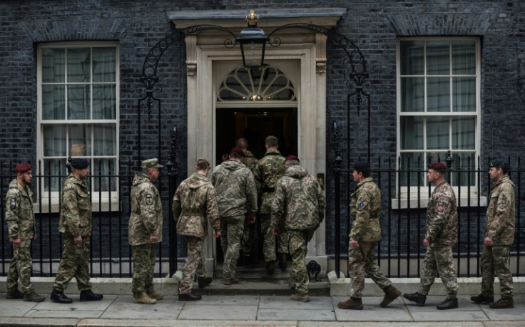 Ukrainian troops enter 10 Downing Street after a one minute's silence