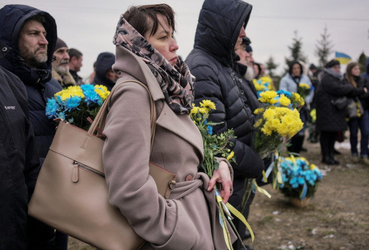 Alla Nechyporenko attends a memorial service for service members and civilians killed by Russian troops on a day of the first anniversary of Russia's attack on Ukraine, in Bucha