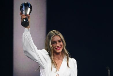 Alexia Putellas poses with the trophy after winning The Best FIFA women's player award