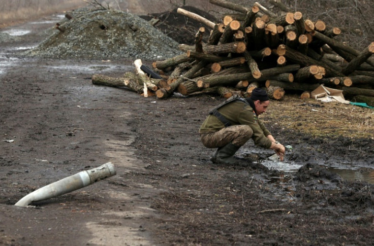 A Ukrainian serviceman washes his hands on the frontline with Russian troops near Vugledar, Donetsk region