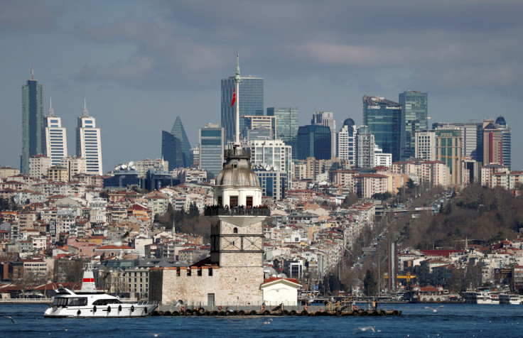 Maiden's Tower, an islet on the Bosphorus, is pictured with the city's skyscrapers in the background in Istanbul