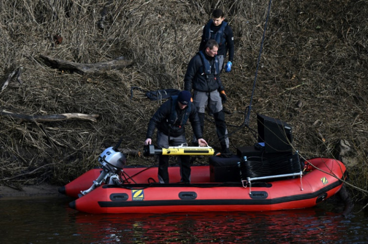 Specialist divers scoured the river for traces of the mother-of-two