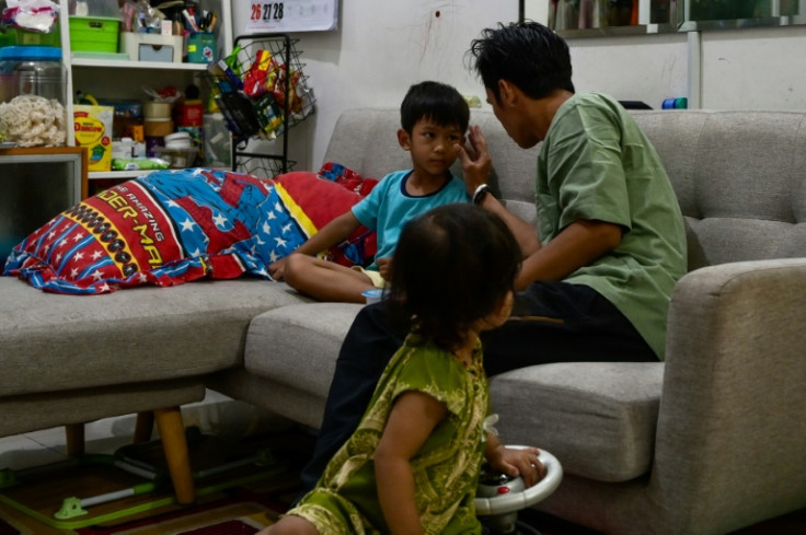 Five-year-old Farrazka udnerwent dialysis for his failing kidneys after he took one of the cough syrups. 'We almost lost him,' his father Agri said