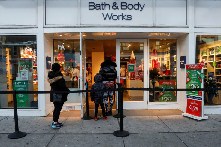 Shoppers wait in line outside a Bath and Body Works retail store in Brooklyn, New York