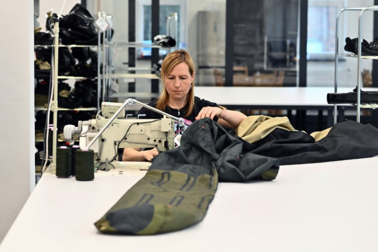 A worker sews the material for an inflatable decoy of a military vehicle in Decin. Founded eight years ago, the Inflatech makes more than 30 types of inflatable decoy weapons