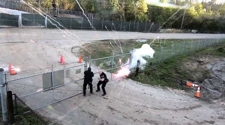 Protesters and police members clash at the construction site of an Atlanta police training center