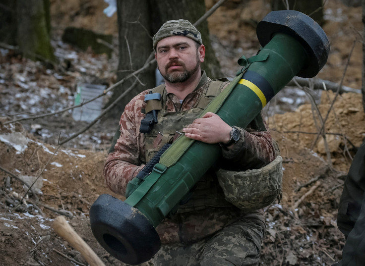 Ukrainian service member holds a Javelin missile system at a position on the front line in the north Kyiv region