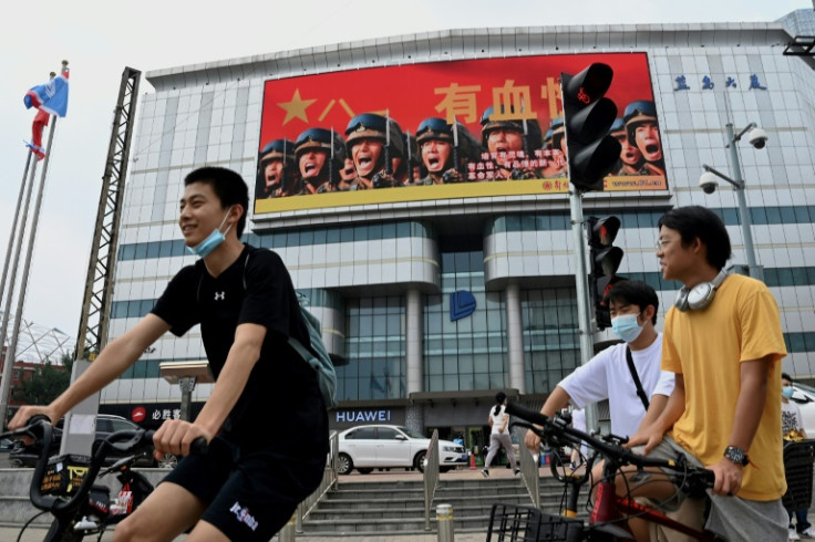 A large screen in Beijing in August 2022 promotes the People's Liberation Army