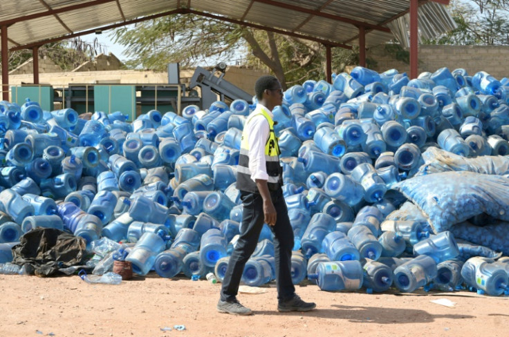 Senegalese rubbish collector Abdou Bakhy Mbacke has a mountain of water canisters awaiting recycling