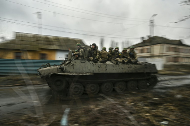 Ukrainian servicemen move towards the front line near the city of Bakhmut