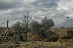Ukrainian servicemen fire with a 105mm howitzer towards Russian positions near Bakhmut