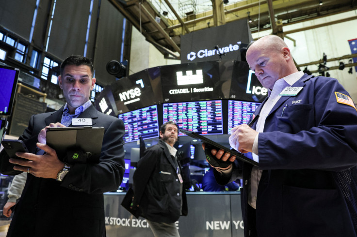 Traders work on the floor of the NYSE in New York